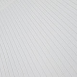 Close-up of the RAG & BONE Ayan Mini Dress with Fringe Trim, showcasing its white fabric detailed with evenly spaced, radiating lines that form a subtle fan-like pattern.