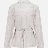 Back view of the RAG & BONE Chappell Plaid Linen Blazer, featuring a light beige check pattern, long sleeves, notched collar, and removable waist tie. Its tailored fit offers a refined look.