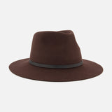 The Dakota Wool Fedora by RAG & BONE is a dark brown hat made from premium wool felt, accented with a sleek leather band at the base of the crown and shown against a white background.