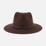 Introducing the RAG & BONE Dakota Wool Fedora, a wide-brimmed dark brown hat expertly crafted from wool felt and accented with a sleek black band featuring a subtle gold detail, photographed against a white background.