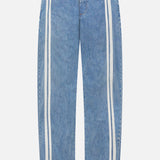 The Featherweight Logan Track Pant in Eversport by RAG & BONE features light blue denim, relaxed fit, elastic waistband, and wide straight legs with two parallel white stripes along the outer sides from waist to hem.