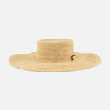 The Frankie Paracord Boater Hat by RAG & BONE is a wide-brimmed, natural raffia sun hat with a flat crown and UPF 50+ protection, shown against a plain white background.
