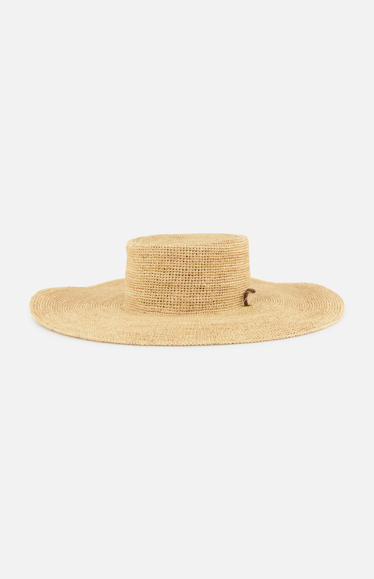 The Frankie Paracord Boater Hat by RAG & BONE is a wide-brimmed, natural raffia sun hat with a flat crown and UPF 50+ protection, shown against a plain white background.