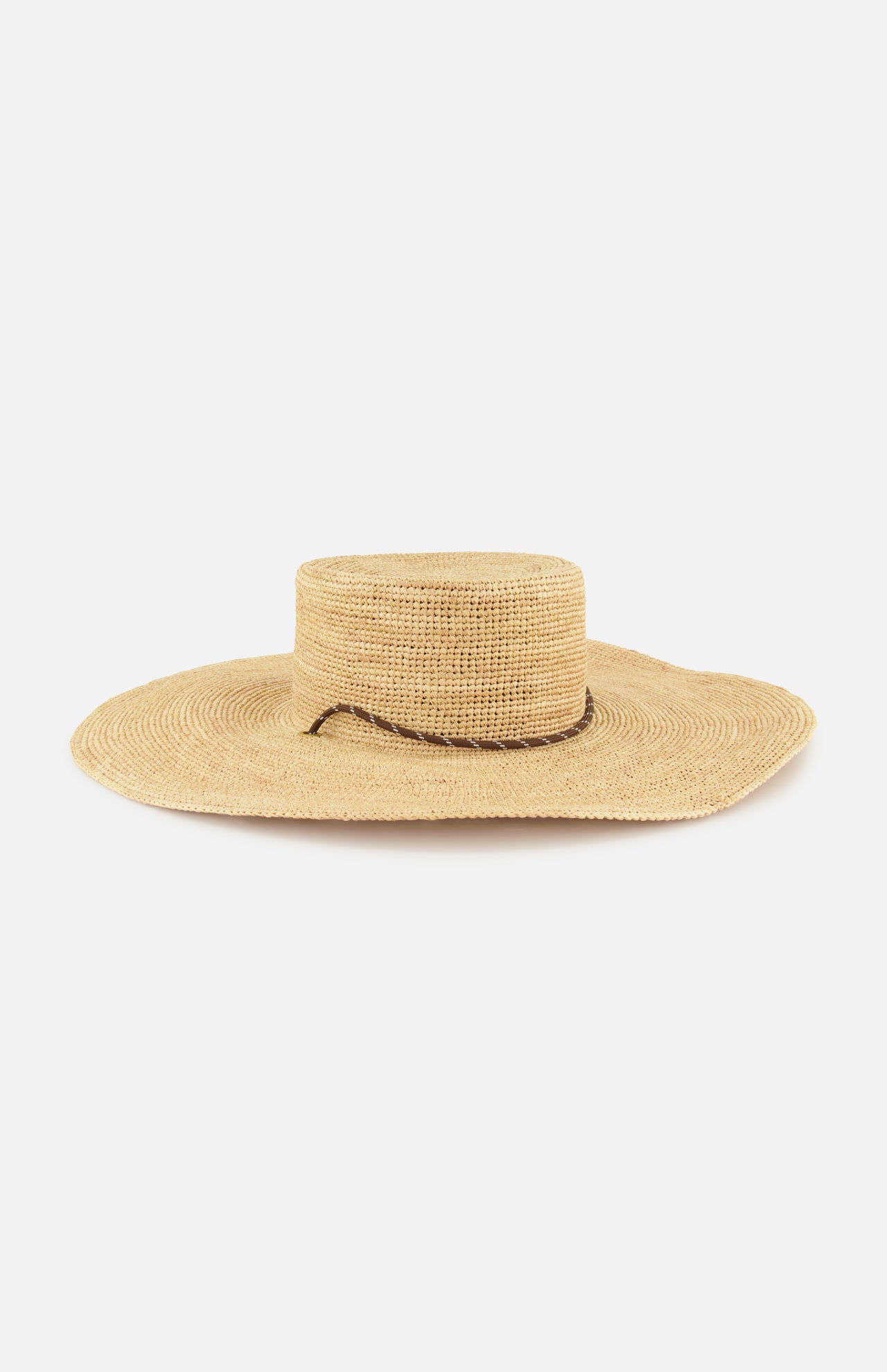 The RAG & BONE Frankie Paracord Boater Hat is a wide-brimmed raffia sun hat with a flat crown, simple woven texture, thin dark brown band, and UPF 50+ protection, shown against a white background.