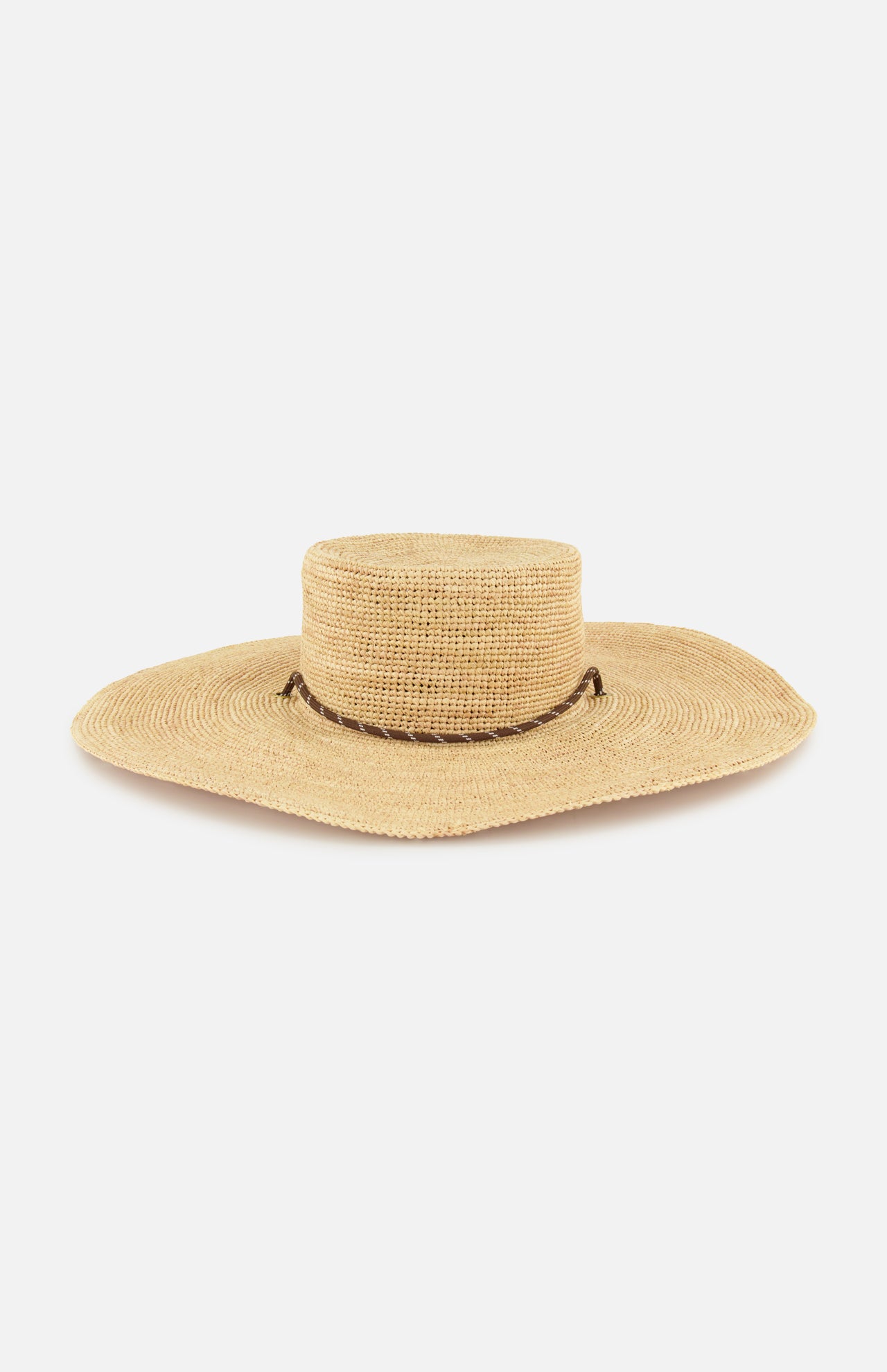The RAG & BONE Frankie Paracord Boater Hat is a wide-brimmed, natural raffia sun hat with a flat crown and a brown paracord trim, shown against a white background.