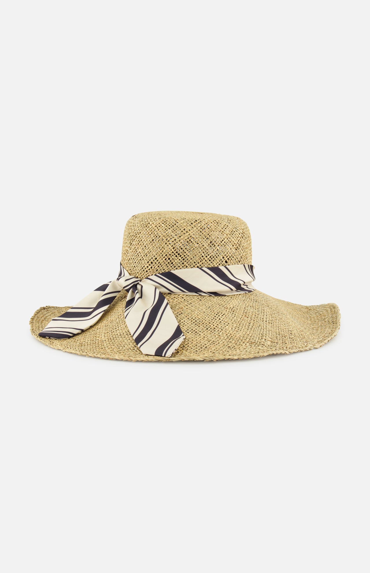 The RAG & BONE Garden Seagrass Hat with Scarf is a wide-brimmed summer hat, crafted from sea grass and adorned with a beige and black striped ribbon bow, shown on a plain white background.