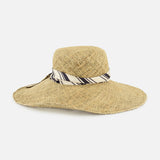 The RAG & BONE Garden Seagrass Hat with Scarf features a wide brim and a black-and-white striped ribbon at the crown, shown against a plain white background.