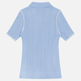 The Harper Short Sleeve Cardigan Sweater by RAG & BONE is shown from the back in light blue, featuring white stitching on sleeve seams and a flat collar, set against a plain white background.