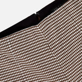 Close-up of the RAG & BONE Irina Printed Kick Flare Pant in brown and white ponte micro check, with a visible black zipper along the edge. The background is plain white.