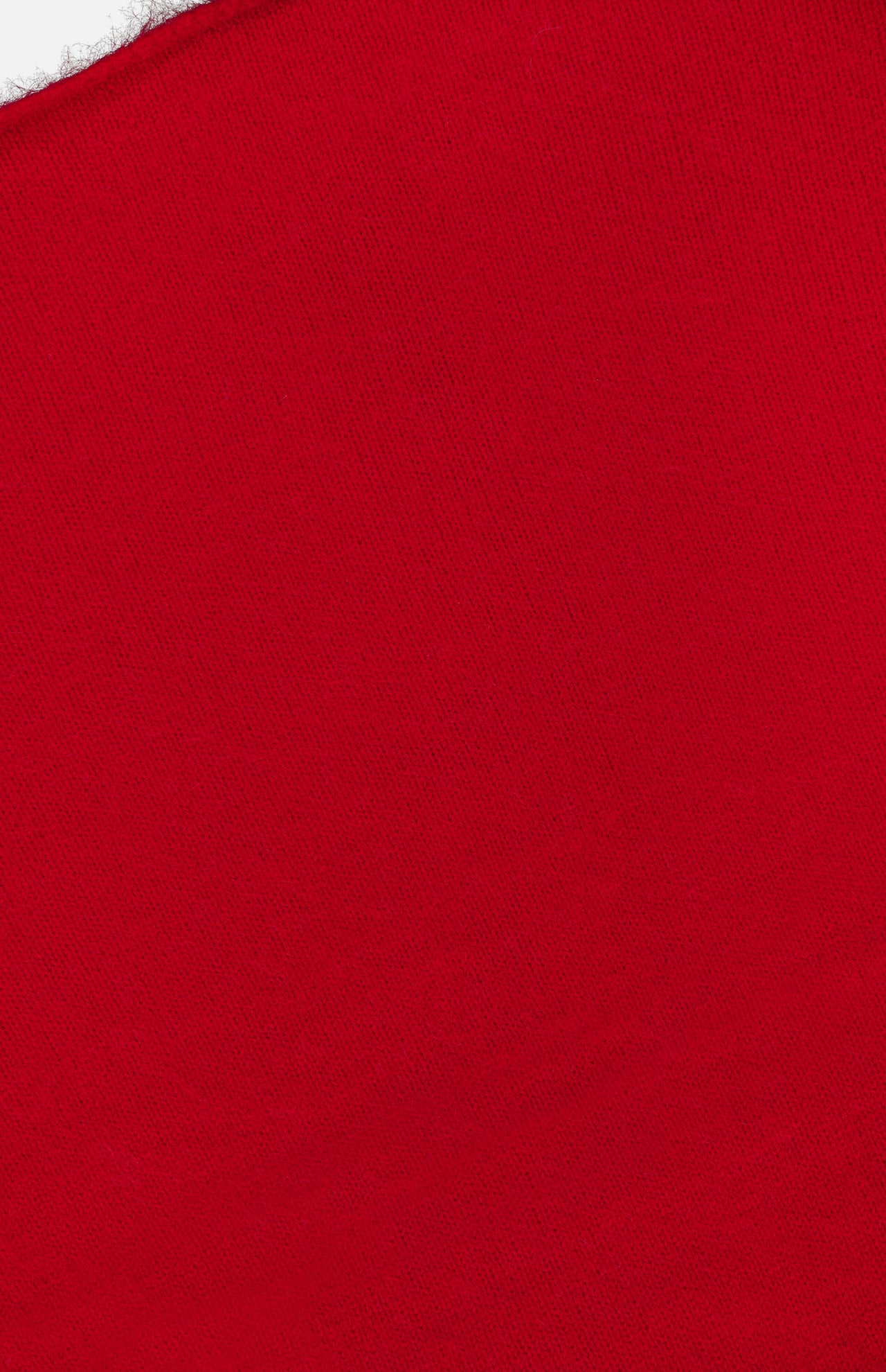 A close-up of a bright red triangular Jada Brushed Cashmere Bandana Scarf with a fuzzy edge.