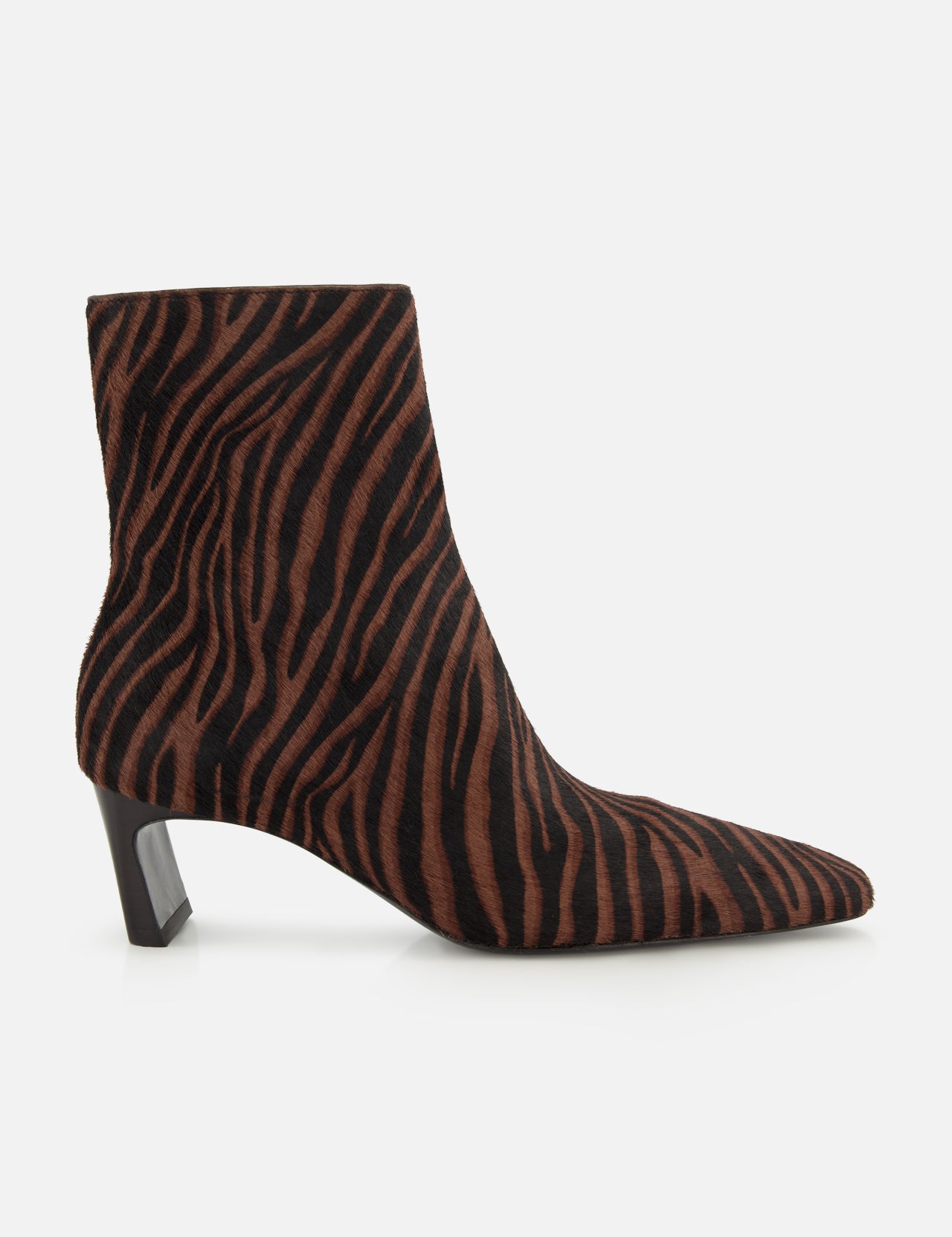 The Kai Zebra Ankle Boot by RAG & BONE features brown and black zebra-print calf hair, a pointed toe, and a low angled block heel, shown from the side on a white background.