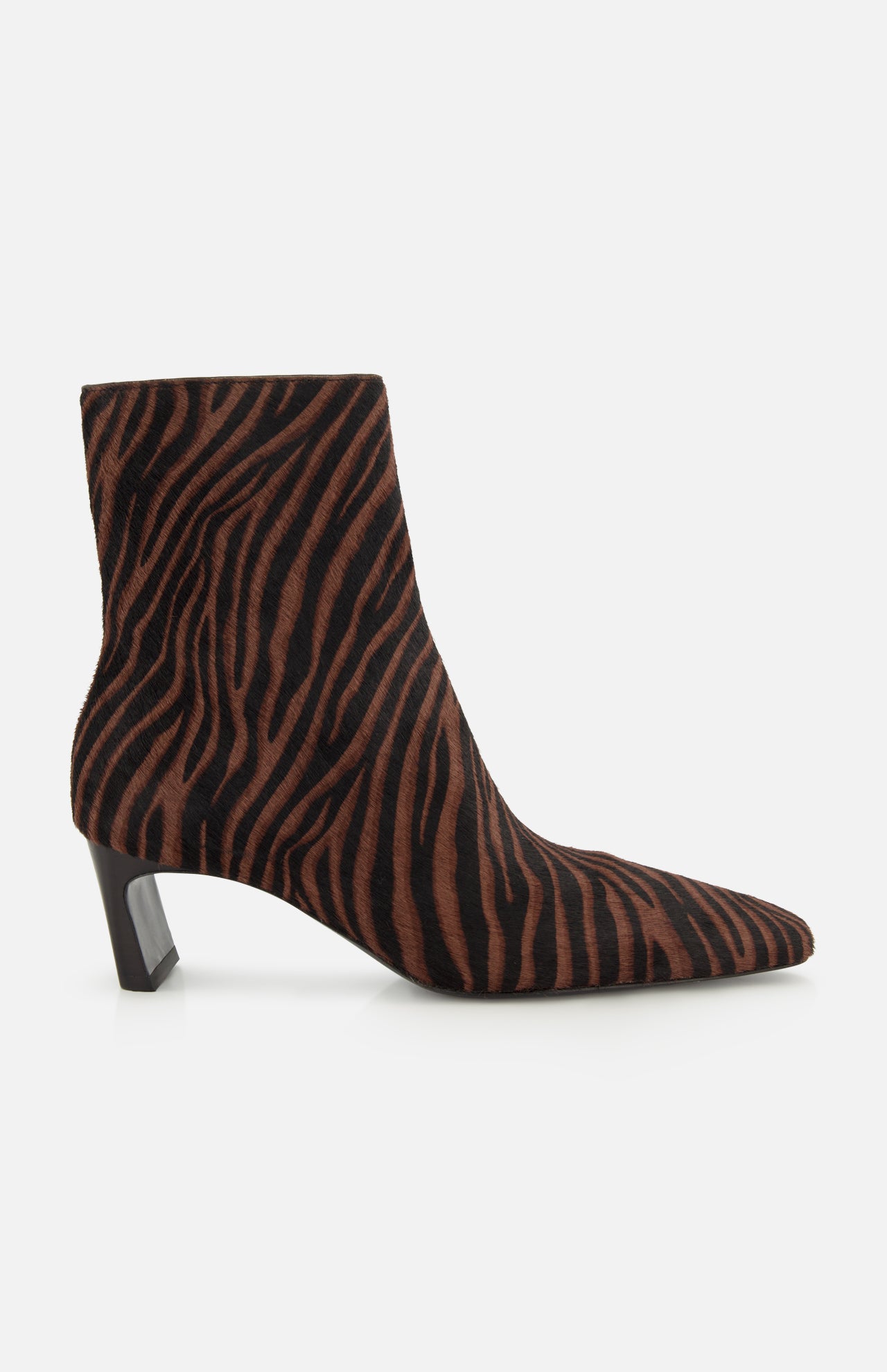 The Kai Zebra Ankle Boot by RAG & BONE features brown and black zebra-print calf hair, a pointed toe, and a low angled block heel, shown from the side on a white background.