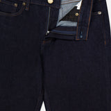 The RAG & BONE Kinsley Low Rise Full Bootcut Jean in Dark Rinse, crafted from vintage stretch denim, features copper rivets and a brass button, with the partially unzipped fly revealing the inside waistband and label. Designed in a size 27 with classic five-pocket styling.