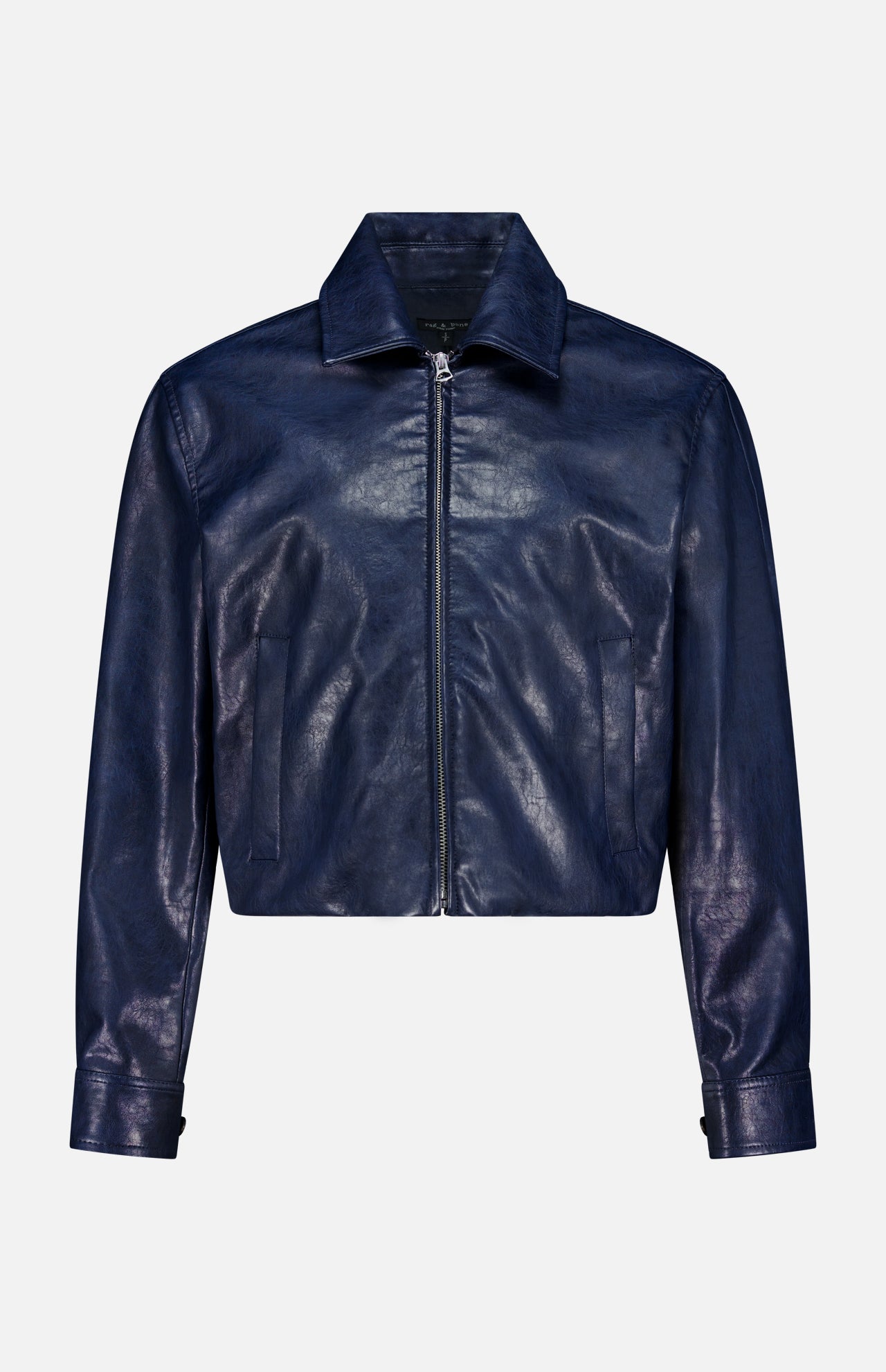 The Krista Faux Leather Jacket by RAG & BONE—a dark blue cropped bomber style with a pointed collar, front zipper, and long sleeves with cuff details—is displayed against a plain white background.