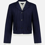 The Lawrence Striped Crop Blazer by RAG & BONE features navy pinstripe herringbone, three buttons, a notched collar, flap pockets, and white cuffs and hem—ideal for modern suiting on a clean white background.