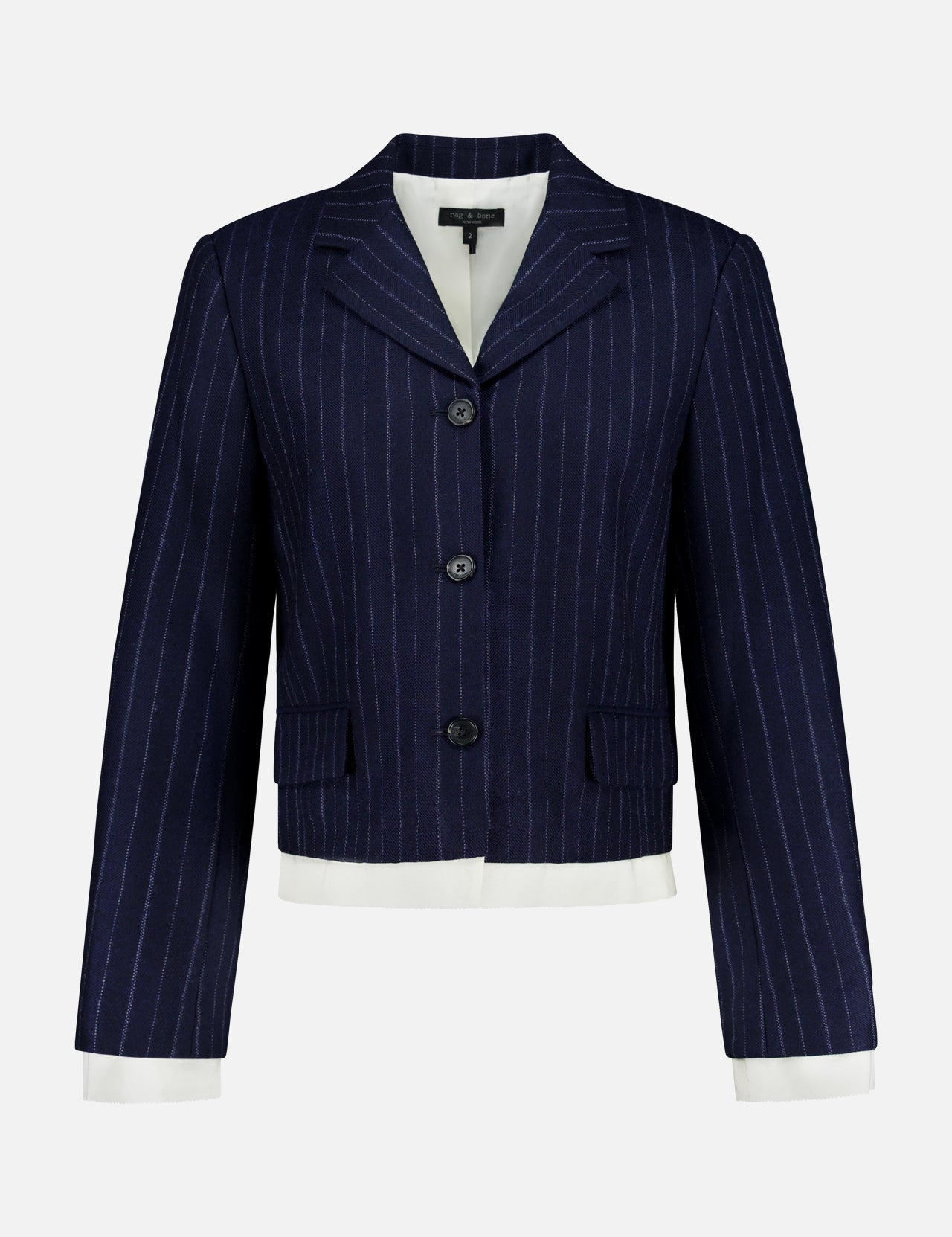 The Lawrence Striped Crop Blazer by RAG & BONE features navy pinstripe herringbone, three buttons, a notched collar, flap pockets, and white cuffs and hem—ideal for modern suiting on a clean white background.