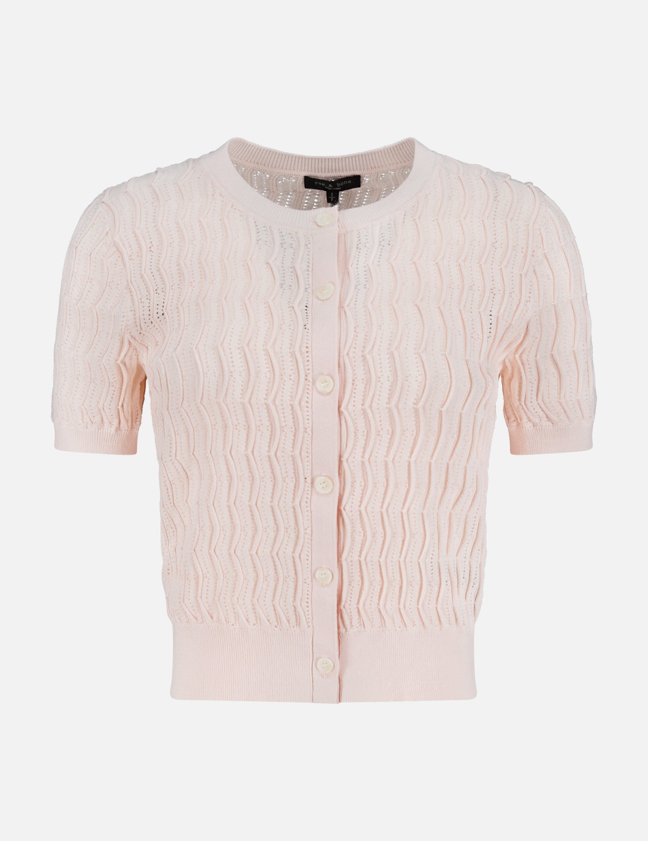 The RAG & BONE Leslie Short Sleeve Cardigan is a light pink, delicate knit featuring a zigzag lace pattern, short sleeves, button-front closure, and ribbed trim, shown on a plain white background.