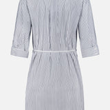 The Lucia Stripe Mini Dress by RAG & BONE features blue and white vertical stripes, a knee-length cut, long sleeves, a collar, and a waist tie; shown from the back.
