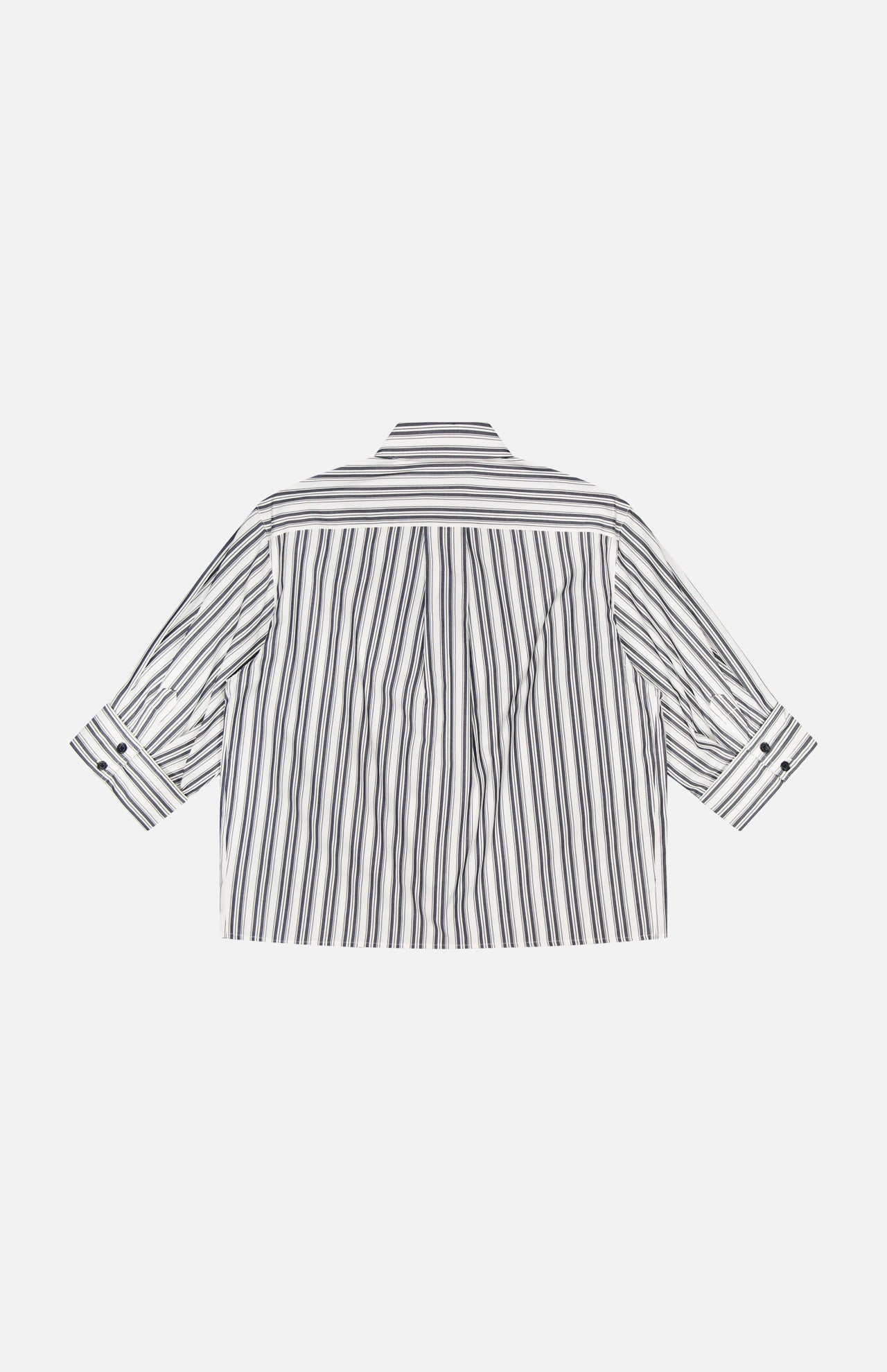 The Lucia Stripe Poplin Shirt by RAG & BONE is a loose, boxy-fit long-sleeve with black vertical stripes on white cotton poplin, buttoned cuffs, and a classic collar, shown from the back.