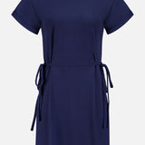 The RAG & BONE Mica Tie Tee Dress is a short-sleeved, knee-length navy cotton dress with a round neckline and adjustable side waist ties, shown on a plain white background.