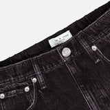 Close-up of the waistband and pockets of the Miramar Mallow Wide Leg Pull On Pant in Belmont by RAG & BONE, highlighting its black denim look, silver button detail, and signature sweatpant-jean style.