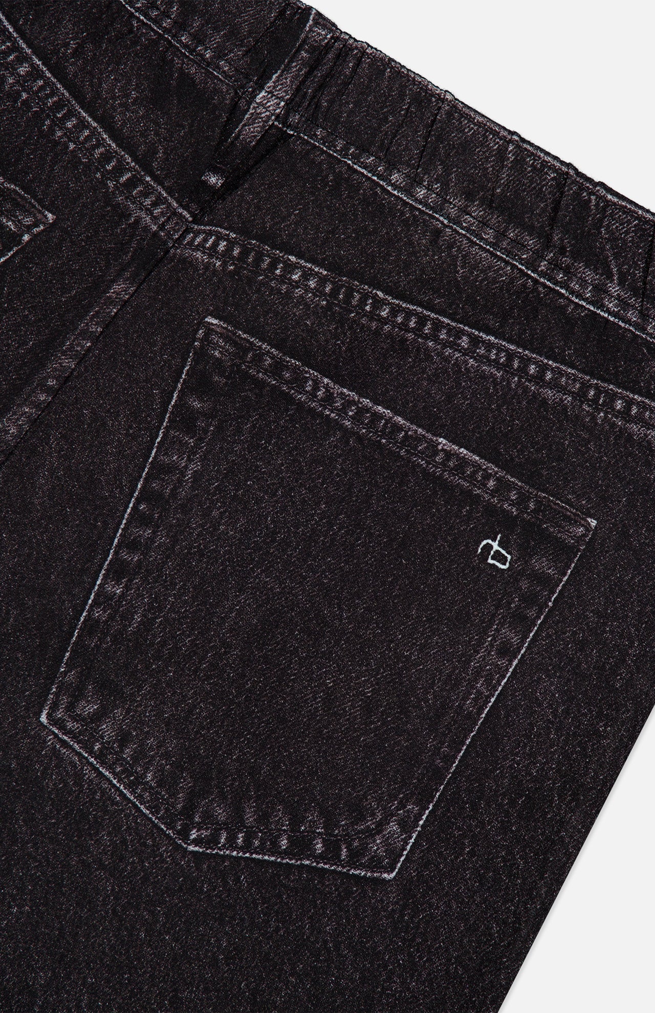 Close-up of the back pocket of Miramar Mallow Wide Leg Pull On Pant in Belmont by RAG & BONE, featuring a small white stitched logo, visible seam details, and a modern wide-leg silhouette.