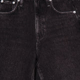 Close-up of the Miramar Mallow Wide Leg Pull On Pant in Belmont by RAG & BONE, featuring black denim look, front pockets, belt loops, silver rivets, and a metal button for a modern wide-leg silhouette.