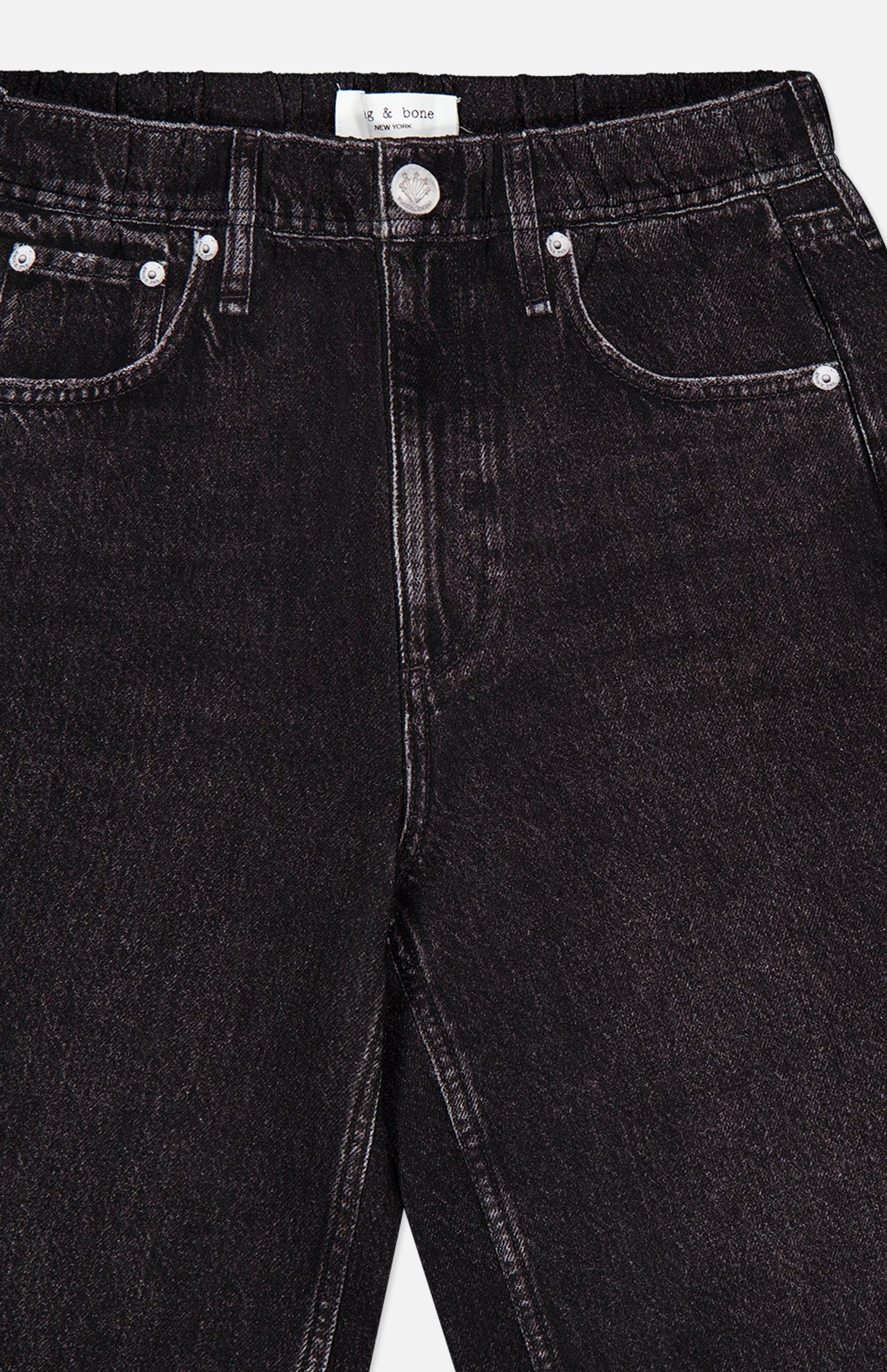 Close-up of the Miramar Mallow Wide Leg Pull On Pant in Belmont by RAG & BONE, featuring black denim look, front pockets, belt loops, silver rivets, and a metal button for a modern wide-leg silhouette.