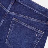 Close-up of the back pocket of blue Miramar Ponte Dahlia Flare Jeans in Nolita by RAG & BONE, featuring visible stitching and a small white embroidered logo on the pocket.