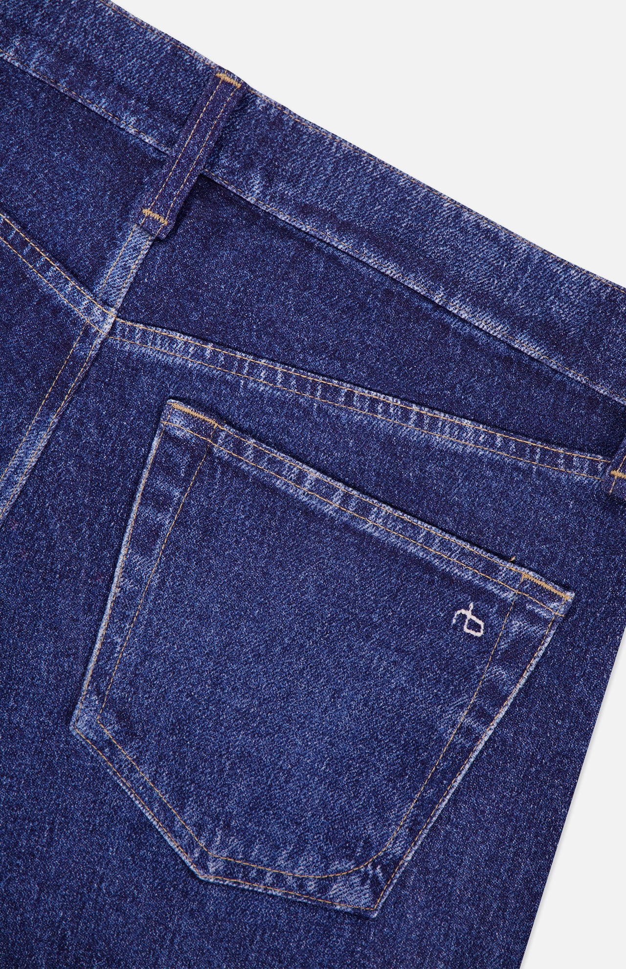 Close-up of the back pocket of blue Miramar Ponte Dahlia Flare Jeans in Nolita by RAG & BONE, featuring visible stitching and a small white embroidered logo on the pocket.