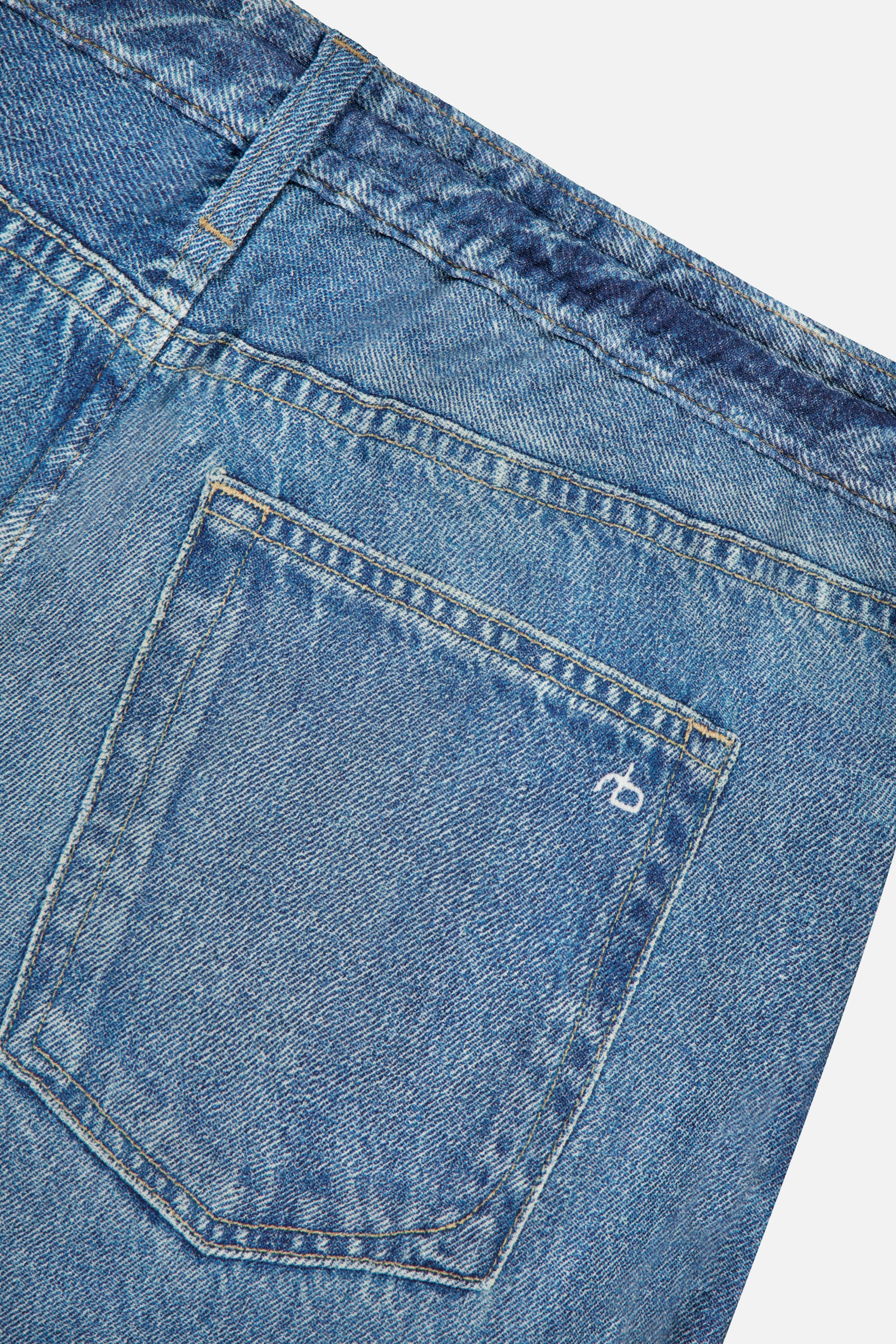 Close-up of the Miramar Terry Drawstring Wide Leg Pant in Ellis by RAG & BONE, showcasing the blue denim look with a back pocket featuring subtle stitching and a small embroidered logo above the pocket.