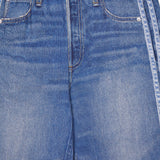 Close-up of the RAG & BONE Miramar Terry Track Pull On Pant in Carst, featuring a blue denim look with front pockets, belt loops, and a faded side stripe detail.