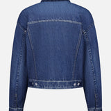 Back view of the RAG & BONE Miramar Terry Trucker Jacket in blue denim look, featuring long sleeves, buttoned cuffs, a pointed collar, visible seam details, and a waistband with two side buttons. Plain white background.