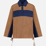 RAG & BONE Oversized Tie Hem Rugby Shirt featuring a brown body, navy blue horizontal chest stripe and collar, button-up neckline, and tie details at the hem and sleeve cuffs.