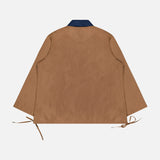 An Oversized Tie Hem Rugby Shirt by RAG & BONE in brown, featuring long sleeves, a dark collar inspired by classic rugby shirts, and adjustable side ties at the hem, is displayed flat on a white background to showcase the back view.