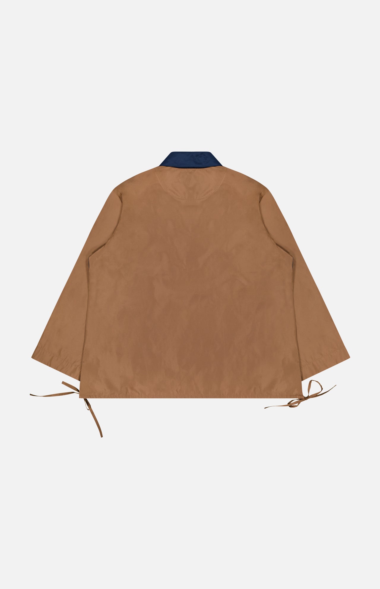 An Oversized Tie Hem Rugby Shirt by RAG & BONE in brown, featuring long sleeves, a dark collar inspired by classic rugby shirts, and adjustable side ties at the hem, is displayed flat on a white background to showcase the back view.