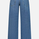 Back view of the RAG & BONE Saige Full Straight Boxer Jean in Echo, featuring two rear pockets, a waistband with belt loops, a brown leather patch, a loose fit, and a slightly faded wash for vintage-inspired style.