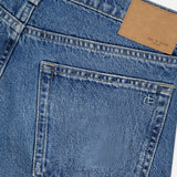 Close-up of the back of RAG & BONE's Saige Full Straight Boxer Jean in Echo, featuring a pocket with subtle stitching, belt loop, and a rectangular tan leather patch on the waistband.