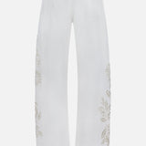 The Shea Full Straight Cut-out Pant by RAG & BONE features a high-rise back view with floral embellishments, plus bead and sequin details along the sides and near the back pockets.