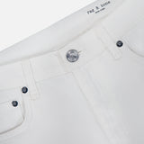 Close-up of the waistband and upper front of the Shea Full Straight Cut-out Pant by RAG & BONE, featuring belt loops, a metal button, visible stitching, and an interior RAG & BONE label.