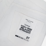 Close-up of the back pocket on Shea Full Straight Cut-out Pant by RAG & BONE, high-rise relaxed fit, featuring a branded tag and size 27.