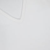 Close-up of the RAG & BONE The Knit V-Neck Tank Top, highlighting its smooth fabric texture and v-neckline against a white background.