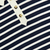Close-up of the RAG & BONE Vintage Terry Striped Polo Sweatshirt in navy blue and white stripes with a cream collar and three-button front, blending classic comfort with sporty preppy style.