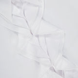 Close-up of the Addison Button Front Shirt by RALPH LAUREN COLLECTION, crafted in Italy from cotton broadcloth with a ruffle trim front and a purple Ralph Lauren label inside the collar.