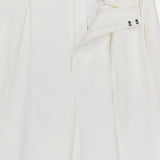 The Greer Pleated Viscose Trouser Pants by RALPH LAUREN COLLECTION feature a high rise, wide-leg silhouette, pleats, and a partially open waistband with double hook-and-bar closure. The smooth, slightly shiny fabric enhances its formal appeal.