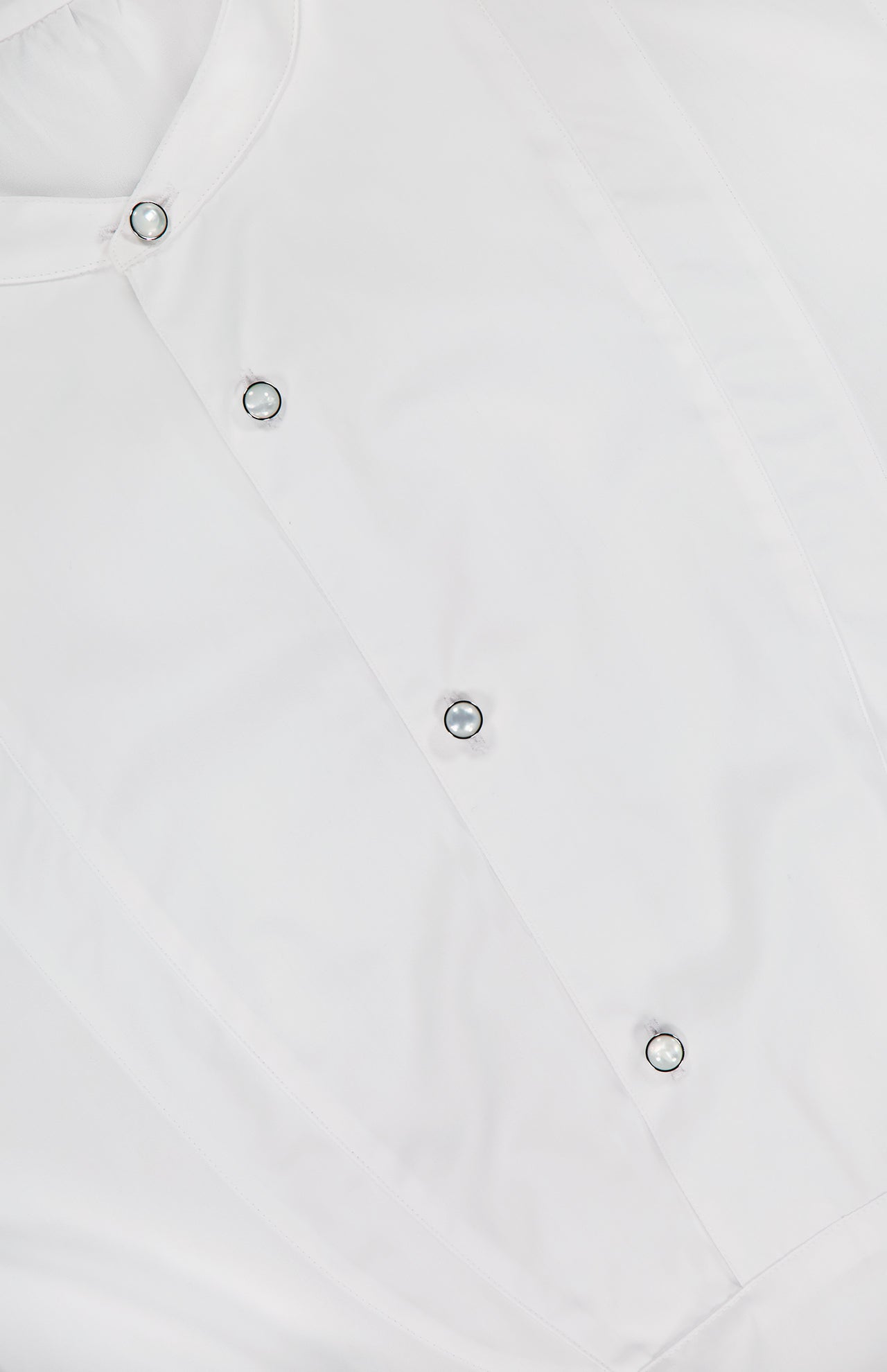 Close-up of a white cotton Ralph Lauren Collection Abbie Long Sleeve Blouse with a band collar and four mother of pearl buttons down the front placket.