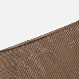 Close-up of the Adrianna Silk Skirt by RALPH LAUREN COLLECTION, featuring a ribbed brown fabric with visible white marks and diagonal seam lines, set against a plain white background.