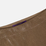 Close-up of the top portion of the Adrianna Silk Skirt by RALPH LAUREN COLLECTION, showcasing a brown ribbed knit texture with a subtle shimmer and a purple tag at the inner waistband, set against a white background.