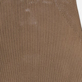Close-up of the Adrianna Silk Skirt from RALPH LAUREN COLLECTION, featuring brown ribbed fabric with a lustrous finish and an angled seam at the top right corner. The texture appears soft and subtly reflective.