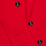 Close-up of the Camden Cashmere Jacket by RALPH LAUREN COLLECTION—a vibrant red, double-breasted blazer with shiny silver buttons, a neatly stitched front pocket, and smooth, finely textured fabric.